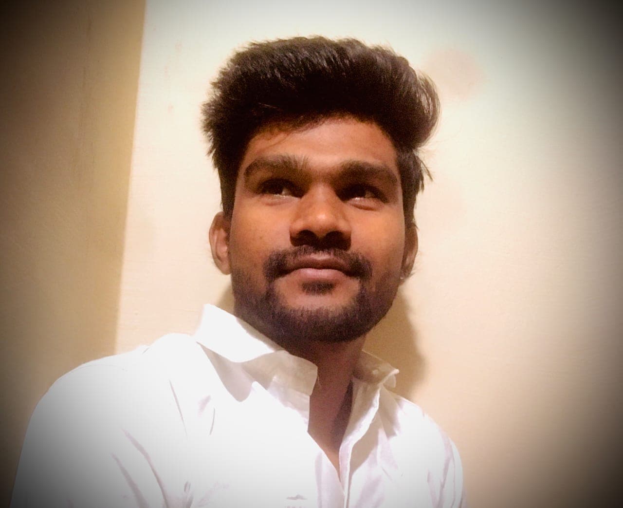 Founder of our cab services standing beside a premium cab in Indore